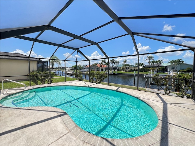 2526 Brazilia Ct, Punta Gorda, FL 33950 - outdoor pool with a water view, a patio, a boat dock, and glass enclosure