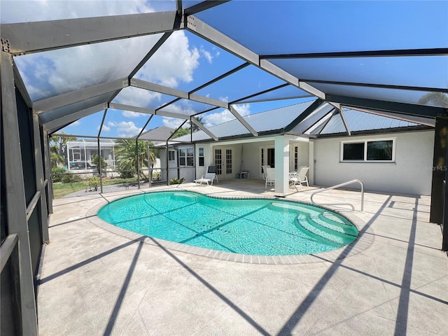2526 Brazilia Ct, Punta Gorda, FL 33950 - outdoor pool featuring a patio area, french doors, and a lanai