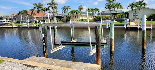 2526 Brazilia Ct, Punta Gorda, FL 33950 - dock with boat lift, a water view, and a residential view