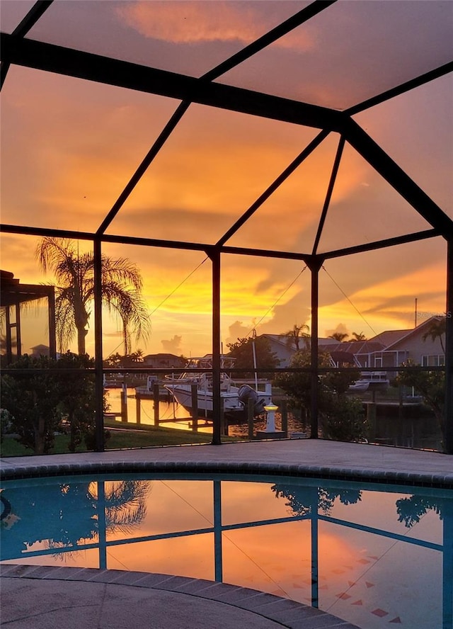2526 Brazilia Ct, Punta Gorda, FL 33950 - pool at dusk featuring a lanai and an outdoor pool