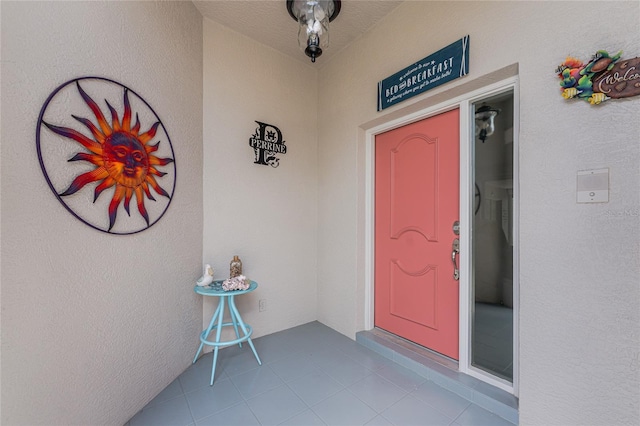 26254 Stillwater Cir, Punta Gorda, FL 33955 - doorway to property with stucco siding