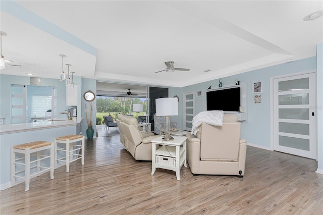 26254 Stillwater Cir, Punta Gorda, FL 33955 - living room with a ceiling fan and light wood finished floors