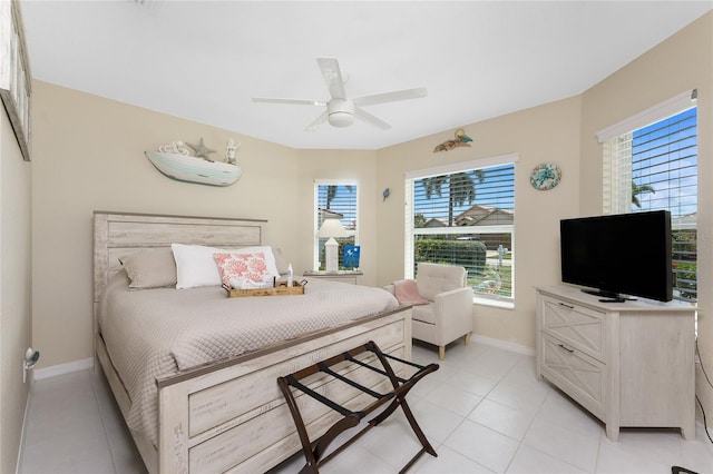 26254 Stillwater Cir, Punta Gorda, FL 33955 - bedroom with light tile patterned flooring and a ceiling fan