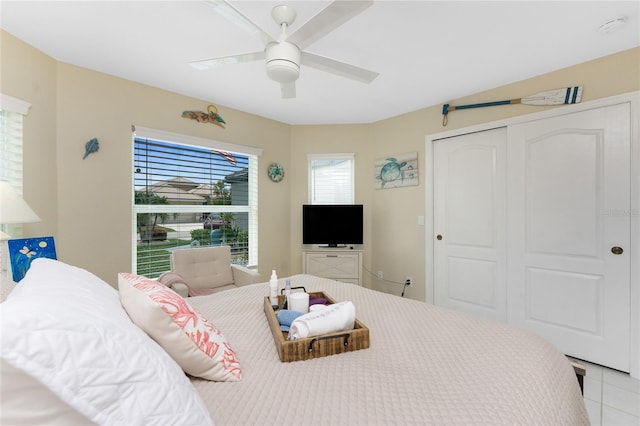 26254 Stillwater Cir, Punta Gorda, FL 33955 - tiled bedroom with a closet and ceiling fan