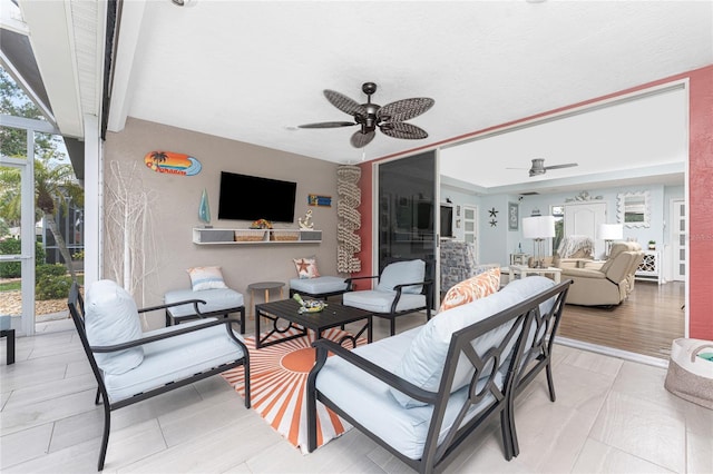 26254 Stillwater Cir, Punta Gorda, FL 33955 - view of patio with an outdoor living space and a ceiling fan