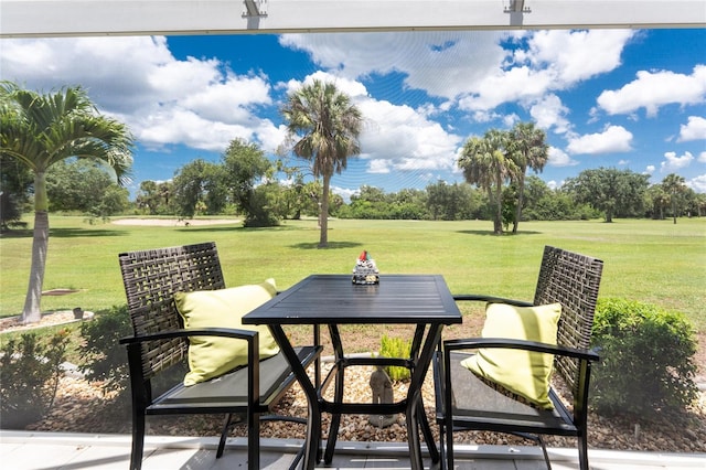 26254 Stillwater Cir, Punta Gorda, FL 33955 - view of patio / terrace with outdoor dining space and view of wooded area