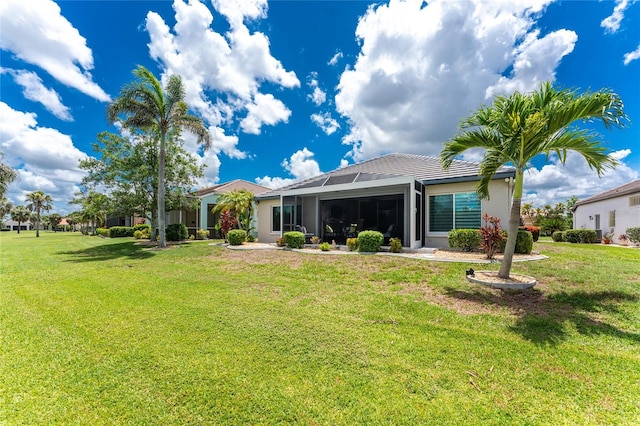 26254 Stillwater Cir, Punta Gorda, FL 33955 - rear view of property with a yard and stucco siding