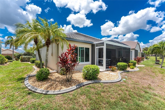 26254 Stillwater Cir, Punta Gorda, FL 33955 - back of property featuring stucco siding, a yard, a tiled roof, and a lanai