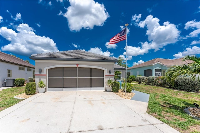 26254 Stillwater Cir, Punta Gorda, FL 33955 - view of front of house featuring a front lawn, stucco siding, driveway, and a tiled roof