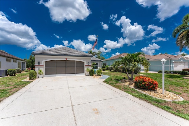 26254 Stillwater Cir, Punta Gorda, FL 33955 - view of front of home with a front lawn, concrete driveway, an attached garage, and stucco siding