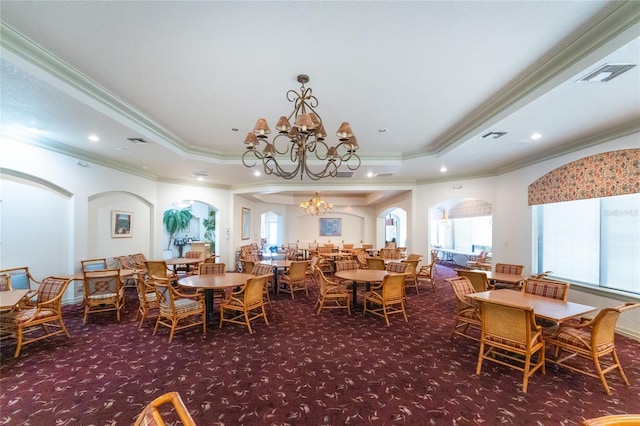 26254 Stillwater Cir, Punta Gorda, FL 33955 - dining area featuring crown molding, carpet floors, healthy amount of natural light, arched walkways, and recessed lighting