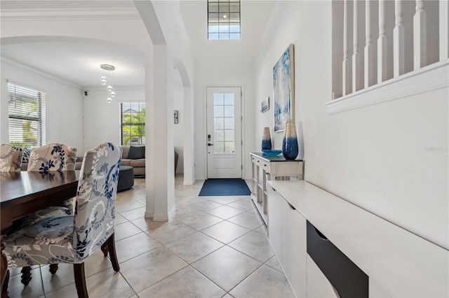 11105 Balfour St E, Venice, FL 34293 - entrance foyer featuring arched walkways, ornamental molding, and light tile patterned floors