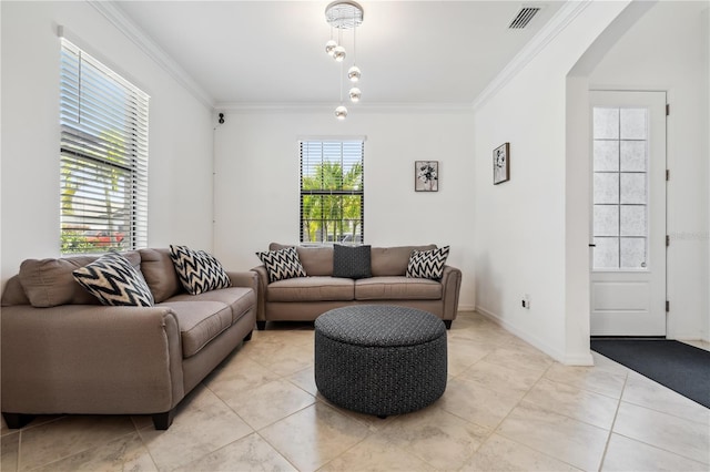 11105 Balfour St E, Venice, FL 34293 - living room featuring ornamental molding, light tile patterned floors, and arched walkways