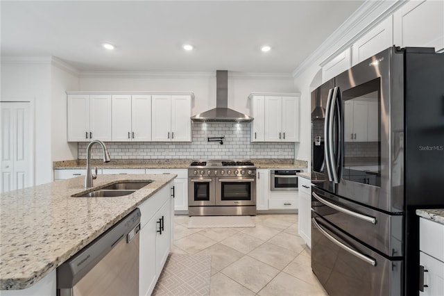 11105 Balfour St E, Venice, FL 34293 - kitchen with appliances with stainless steel finishes, wall chimney range hood, backsplash, white cabinets, and ornamental molding