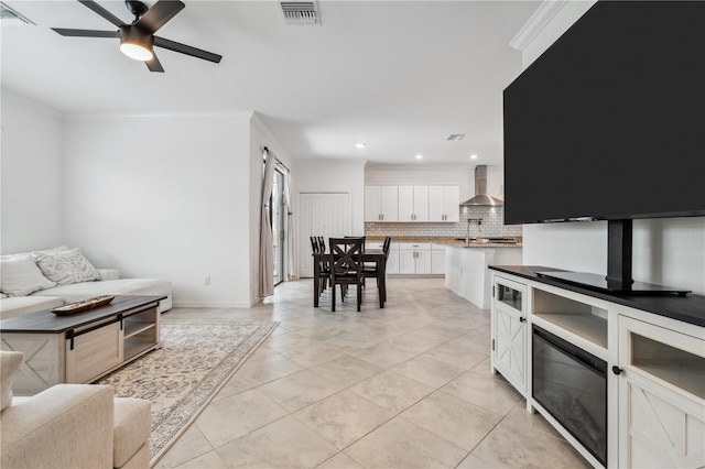 11105 Balfour St E, Venice, FL 34293 - living room with crown molding, ceiling fan, recessed lighting, and light tile patterned floors