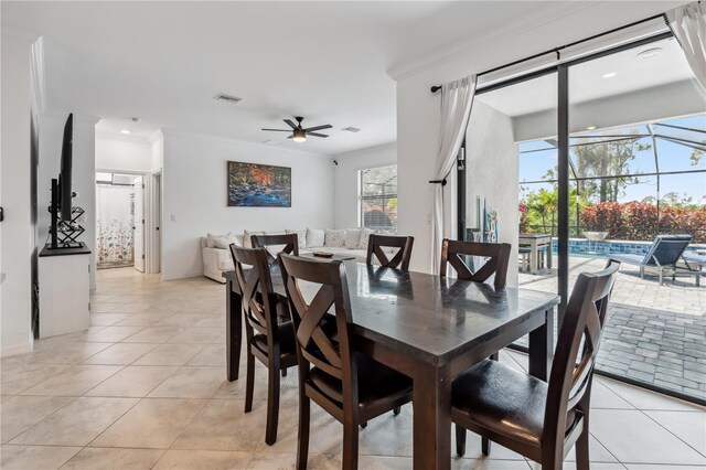 11105 Balfour St E, Venice, FL 34293 - dining area with ceiling fan, light tile patterned floors, ornamental molding, and recessed lighting