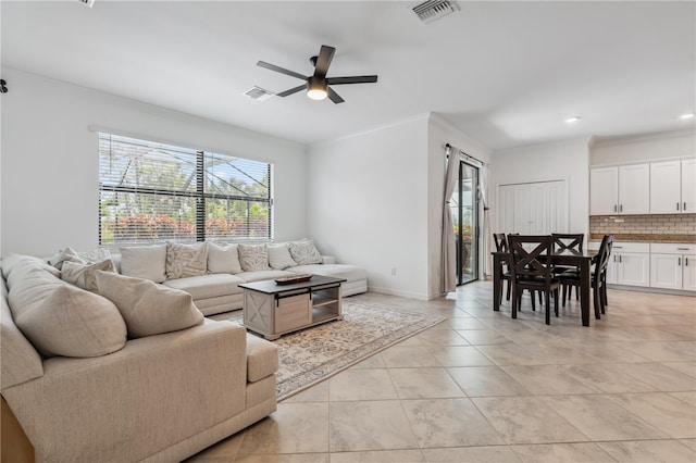 11105 Balfour St E, Venice, FL 34293 - living area featuring a ceiling fan, light tile patterned floors, ornamental molding, and recessed lighting