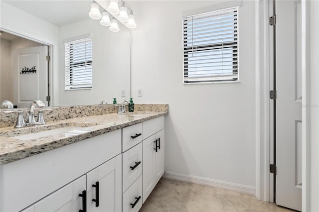 11105 Balfour St E, Venice, FL 34293 - full bath featuring double vanity, a chandelier, and tile patterned flooring