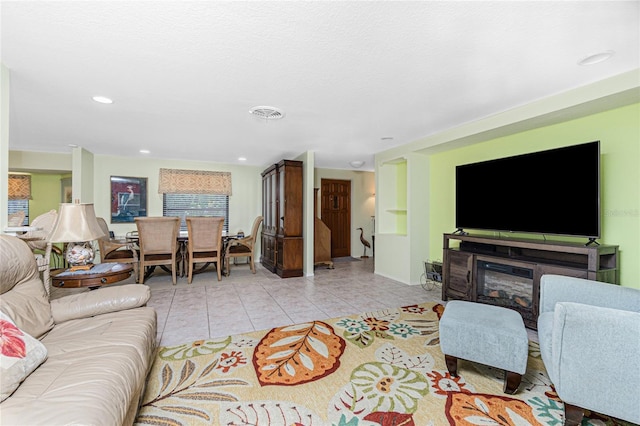 4051 Rock Creek Dr, Port Charlotte, FL 33948 - living area featuring light tile patterned flooring, recessed lighting, and a glass covered fireplace