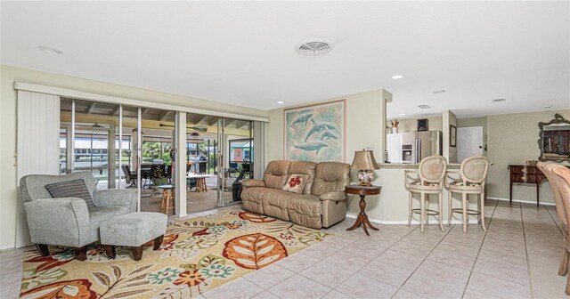 4051 Rock Creek Dr, Port Charlotte, FL 33948 - living area featuring light tile patterned floors