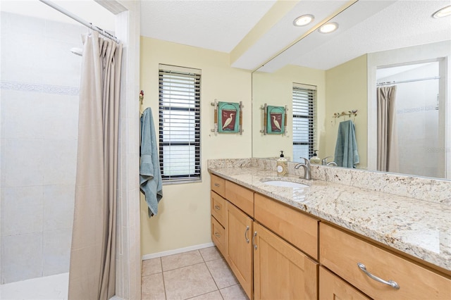 4051 Rock Creek Dr, Port Charlotte, FL 33948 - full bathroom featuring vanity, a tile shower, tile patterned flooring, a textured ceiling, and recessed lighting