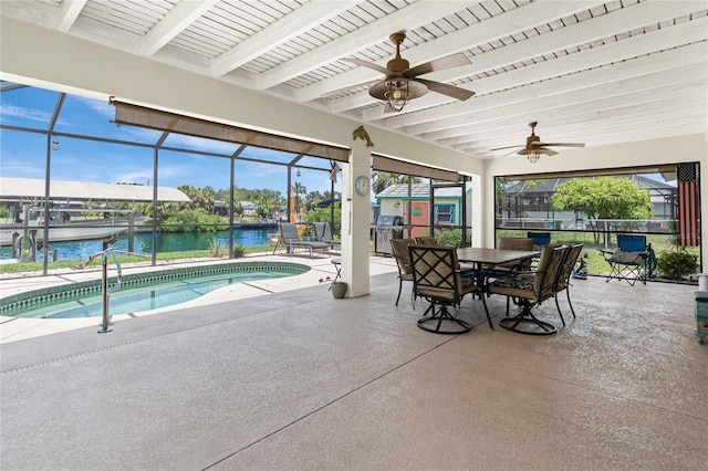 4051 Rock Creek Dr, Port Charlotte, FL 33948 - view of patio with a water view, a ceiling fan, glass enclosure, an outdoor pool, and outdoor dining area