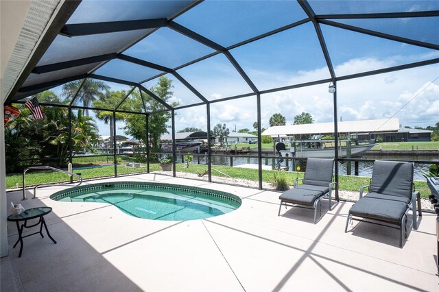 4051 Rock Creek Dr, Port Charlotte, FL 33948 - view of swimming pool with a patio, a water view, a pool, and a dock