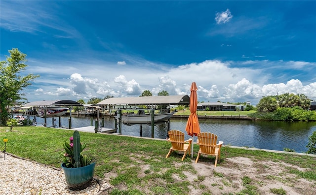 4051 Rock Creek Dr, Port Charlotte, FL 33948 - dock featuring boat lift, a water view, and a yard