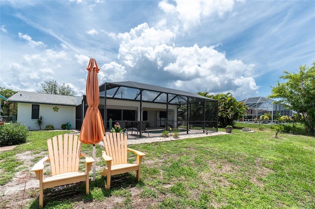 4051 Rock Creek Dr, Port Charlotte, FL 33948 - back of house with a patio area, a lawn, and glass enclosure