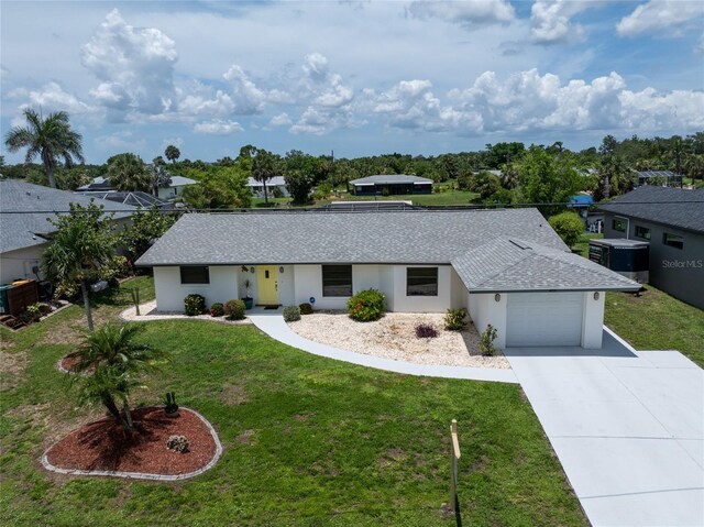 4051 Rock Creek Dr, Port Charlotte, FL 33948 - view of front of house featuring a garage, concrete driveway, a front yard, roof with shingles, and stucco siding
