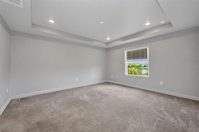 16848 Canopy Garden Dr, Port Charlotte, FL 33953 - carpeted spare room featuring a raised ceiling and recessed lighting