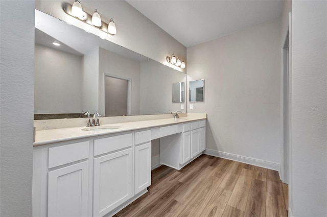 16848 Canopy Garden Dr, Port Charlotte, FL 33953 - bathroom with double vanity and wood finished floors