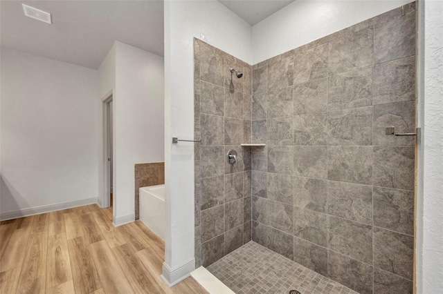 16848 Canopy Garden Dr, Port Charlotte, FL 33953 - full bath with wood finished floors, a tile shower, and a bath