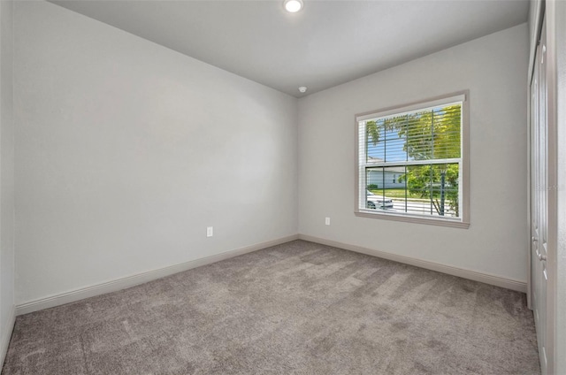 16848 Canopy Garden Dr, Port Charlotte, FL 33953 - spare room featuring light carpet and recessed lighting