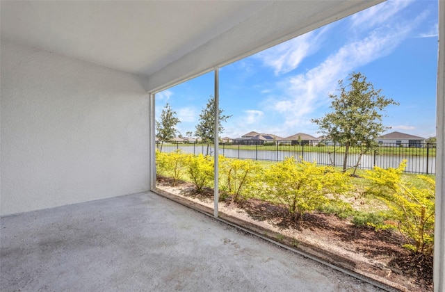 16848 Canopy Garden Dr, Port Charlotte, FL 33953 - unfurnished sunroom featuring a water view and a residential view