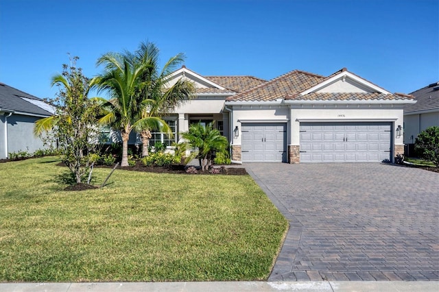 14436 Ponce De Leon Trl, Port Charlotte, FL 33981 - view of front facade with an attached garage, stucco siding, a front lawn, and decorative driveway