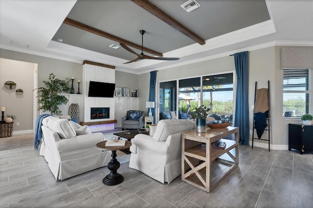 14436 Ponce De Leon Trl, Port Charlotte, FL 33981 - living room featuring plenty of natural light, a fireplace, a ceiling fan, ornamental molding, and beam ceiling