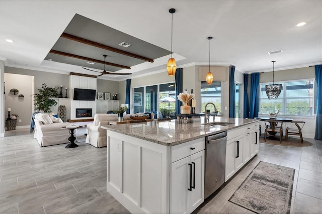 14436 Ponce De Leon Trl, Port Charlotte, FL 33981 - kitchen featuring dishwasher, crown molding, an island with sink, light stone countertops, and white cabinets