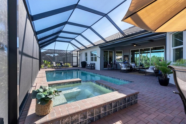 14436 Ponce De Leon Trl, Port Charlotte, FL 33981 - view of pool with a patio area, a pool with connected hot tub, a ceiling fan, and glass enclosure