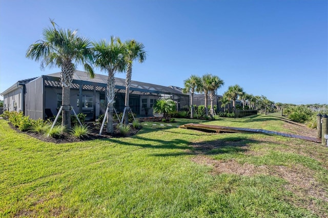 14436 Ponce De Leon Trl, Port Charlotte, FL 33981 - view of grassy yard with glass enclosure
