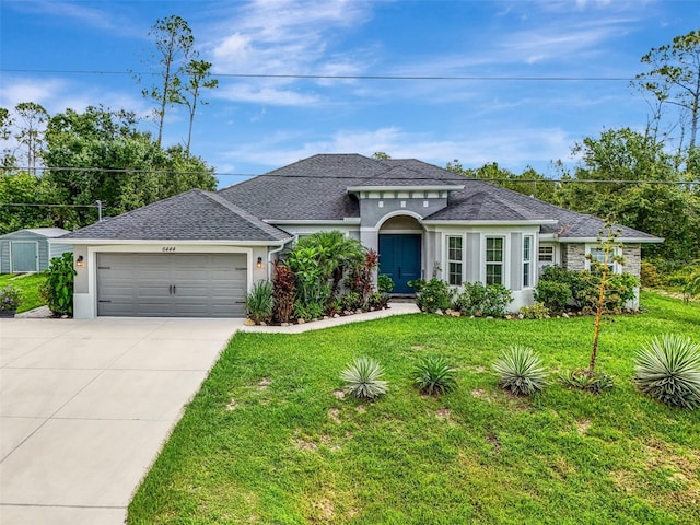 6444 Alhambra Ave, North Port, FL 34291 - view of front of property with a garage, concrete driveway, a front yard, a shingled roof, and stucco siding