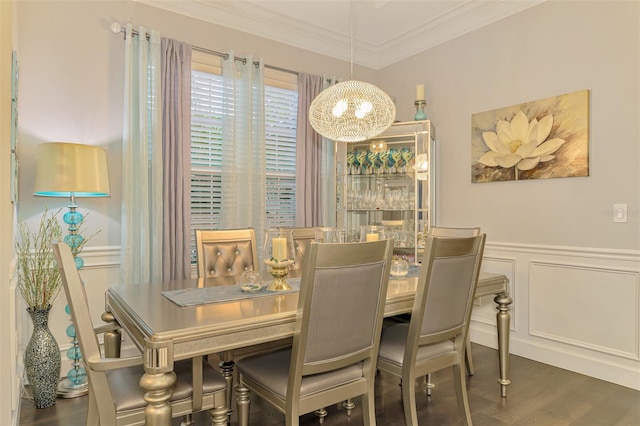 6444 Alhambra Ave, North Port, FL 34291 - dining space with a chandelier, wood finished floors, ornamental molding, a wainscoted wall, and a decorative wall