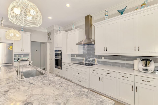 6444 Alhambra Ave, North Port, FL 34291 - kitchen featuring wall chimney exhaust hood, stainless steel appliances, white cabinetry, crown molding, and tasteful backsplash