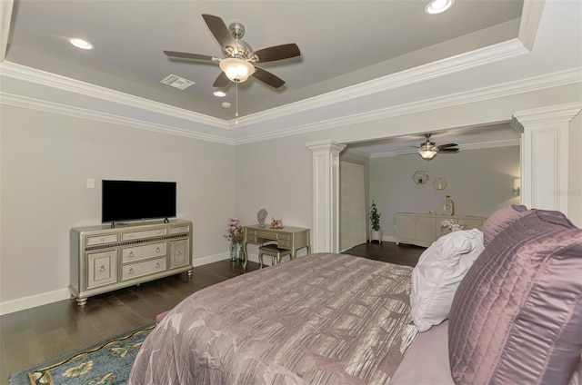 6444 Alhambra Ave, North Port, FL 34291 - bedroom featuring a tray ceiling, decorative columns, dark wood finished floors, ceiling fan, and crown molding