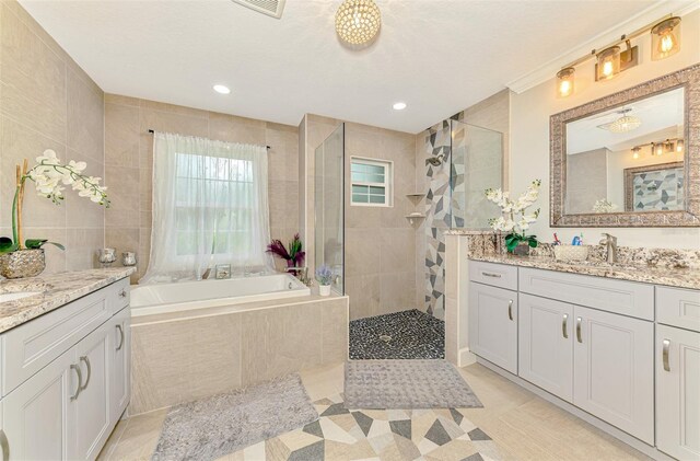 6444 Alhambra Ave, North Port, FL 34291 - bathroom with vanity, a bath, walk in shower, tile patterned floors, and recessed lighting
