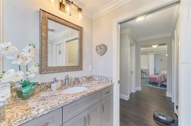 6444 Alhambra Ave, North Port, FL 34291 - bathroom with wood finished floors, vanity, and ornamental molding