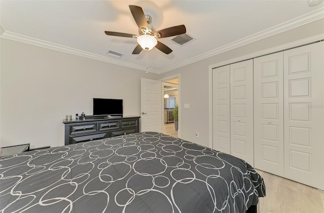 6444 Alhambra Ave, North Port, FL 34291 - bedroom with wood finished floors, a closet, ornamental molding, and ceiling fan