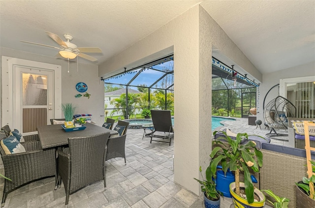 6444 Alhambra Ave, North Port, FL 34291 - view of patio / terrace featuring an in-ground hot tub, a ceiling fan, an outdoor pool, outdoor dining area, and a lanai