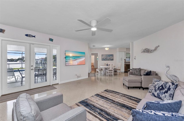 4244 Harbor Blvd, Port Charlotte, FL 33952 - living area with speckle patterned floor, french doors, and ceiling fan