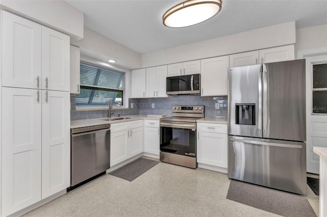 4244 Harbor Blvd, Port Charlotte, FL 33952 - kitchen with appliances with stainless steel finishes, light countertops, and white cabinets